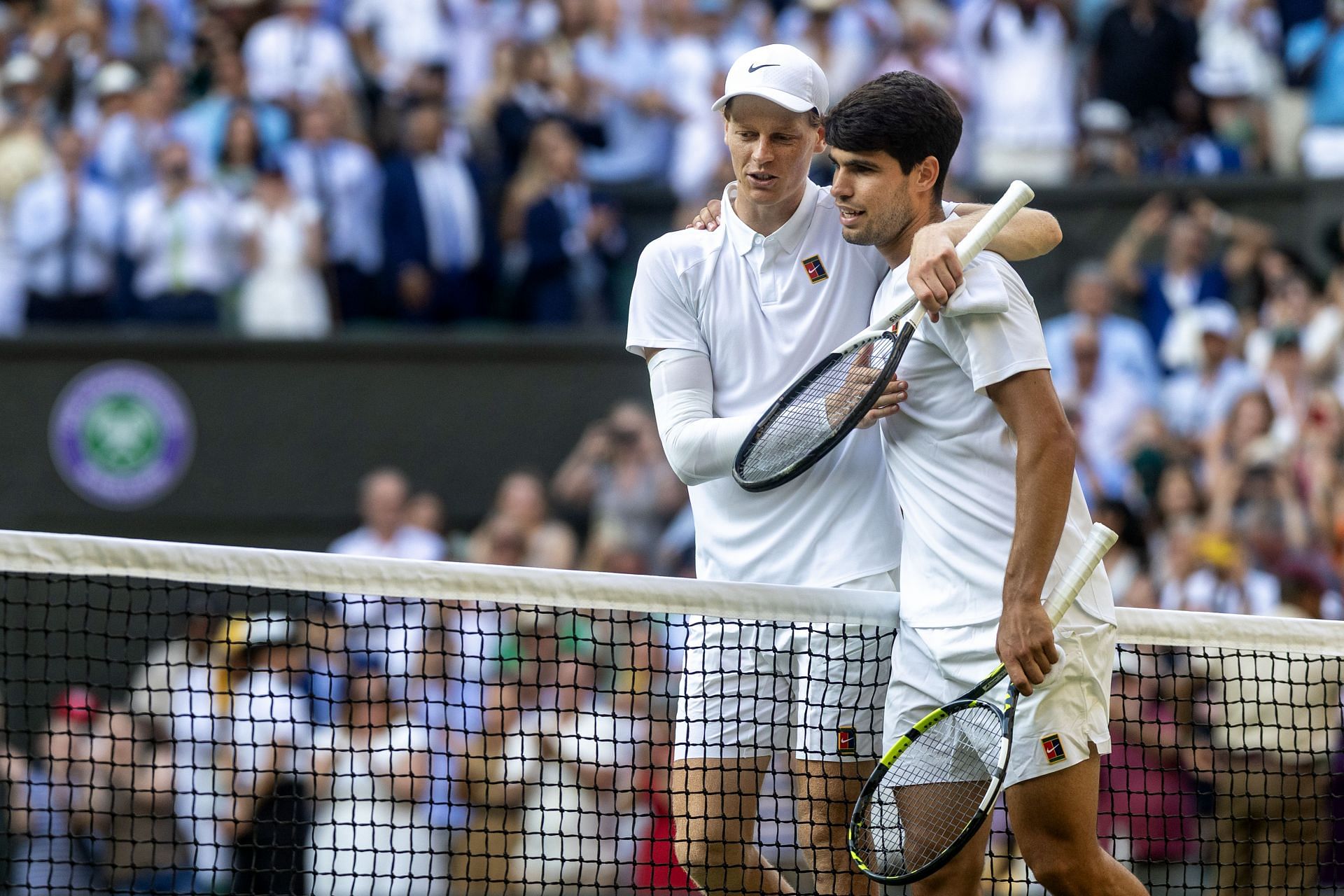 Jannik Sinner and Carlos Alcaraz embrace after the Italian's victory in the men's singles final at the 2025 Wimbledon Championships (Source: Getty)